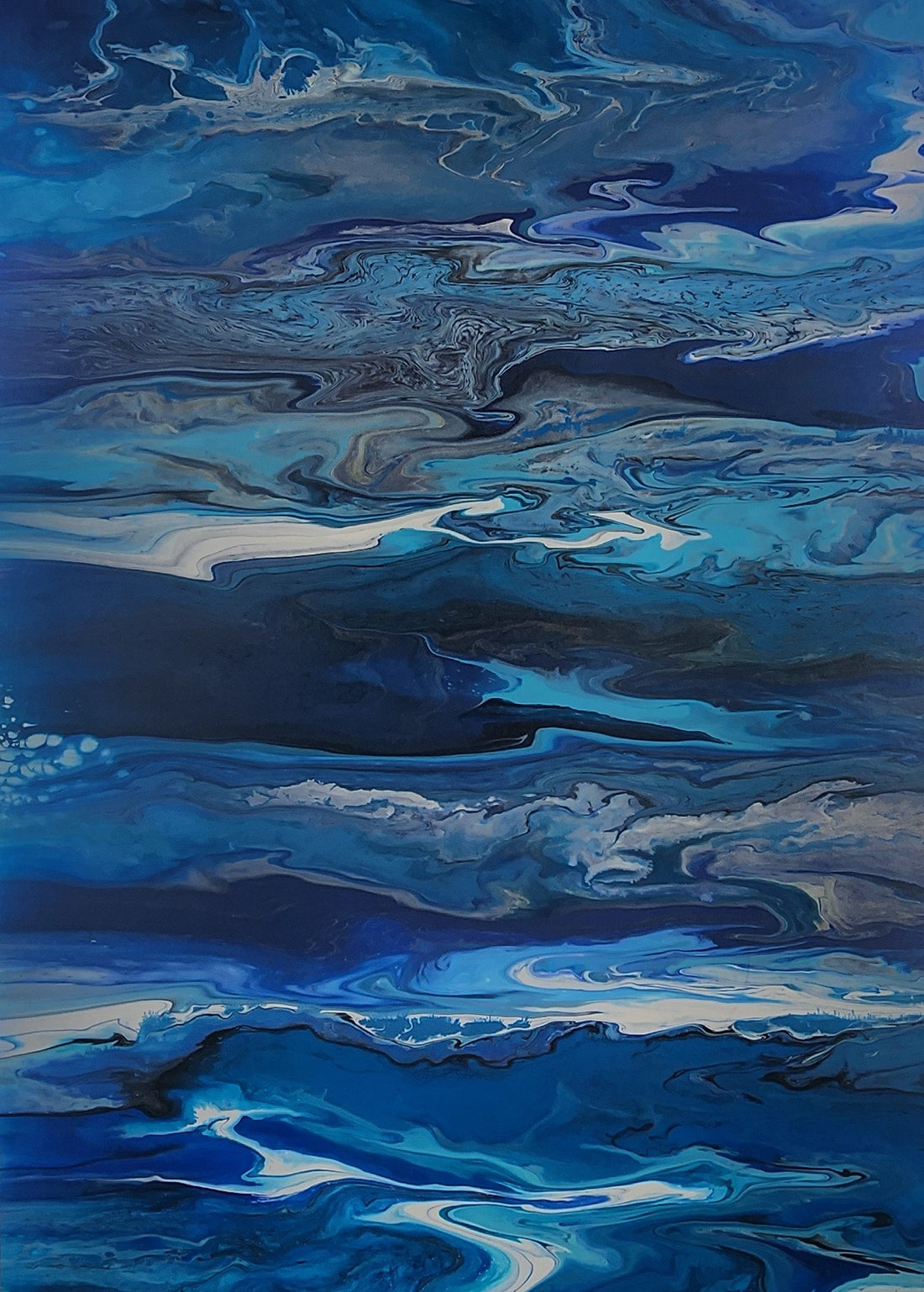 Abstract artwork with swirling various shades of blues. 